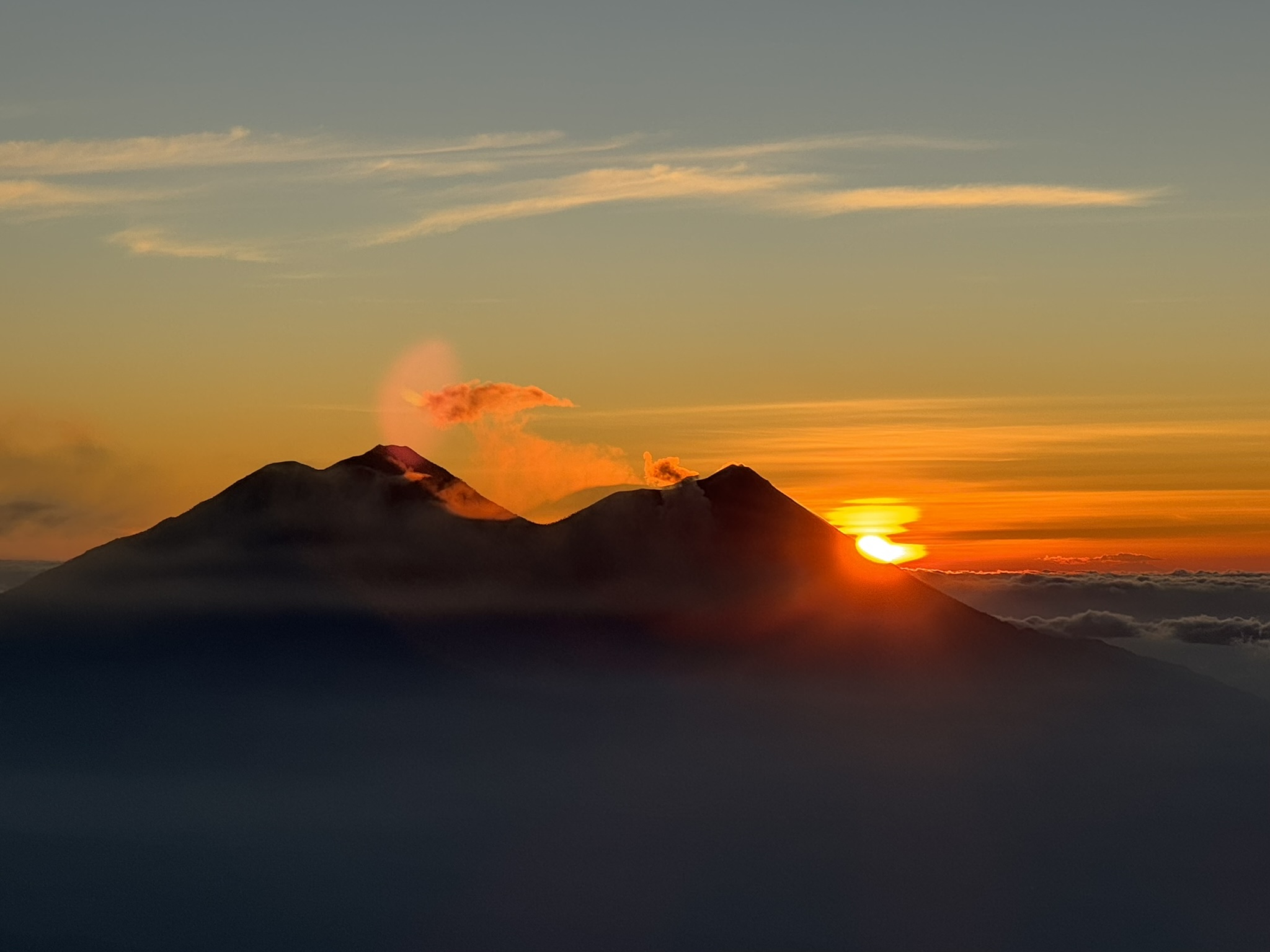 Volcan Atitlan at sunrise, overlooking Volcan Acatenango and Volcan de Fuego